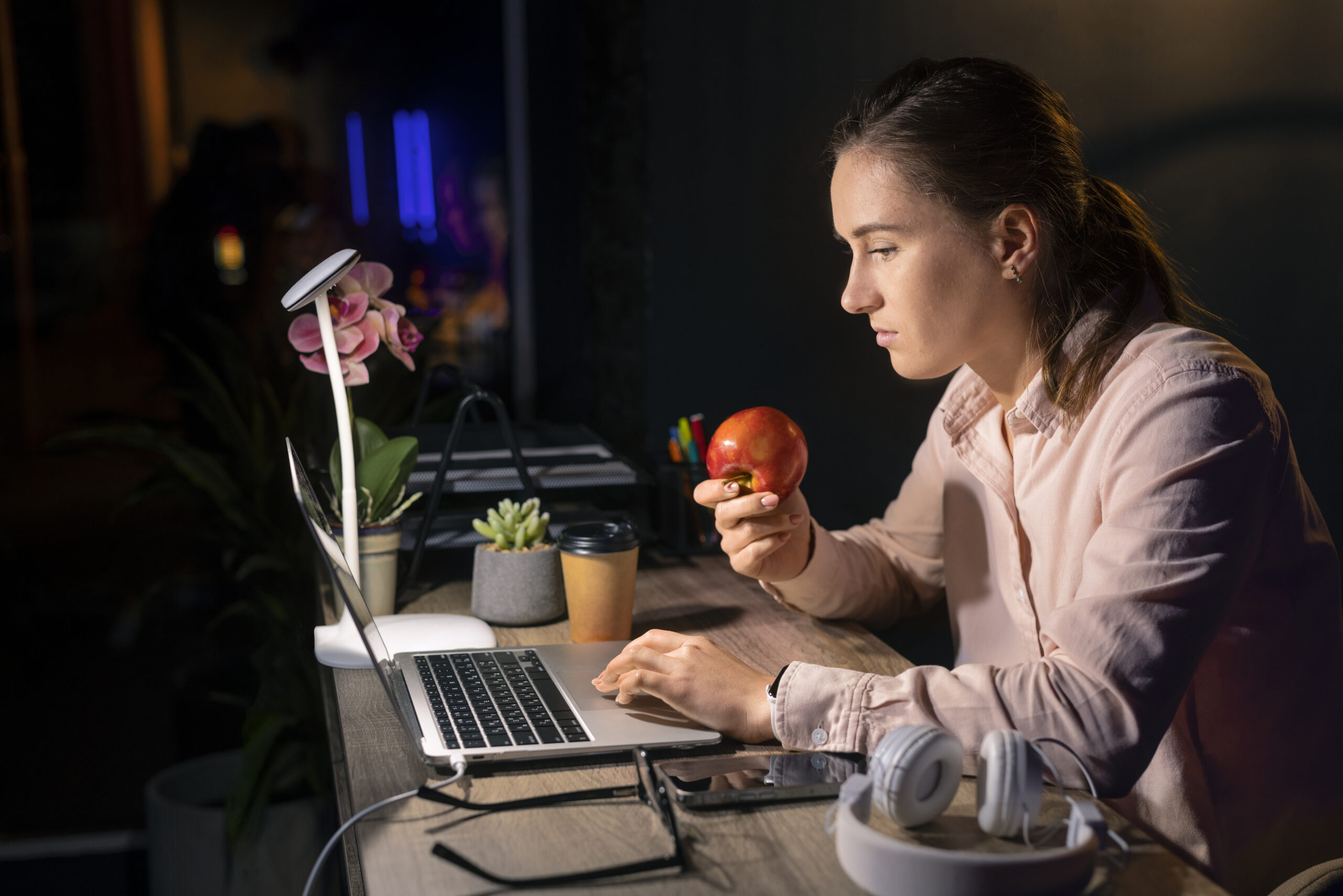 “Person working on laptop with AI interface showing earnings dashboard”